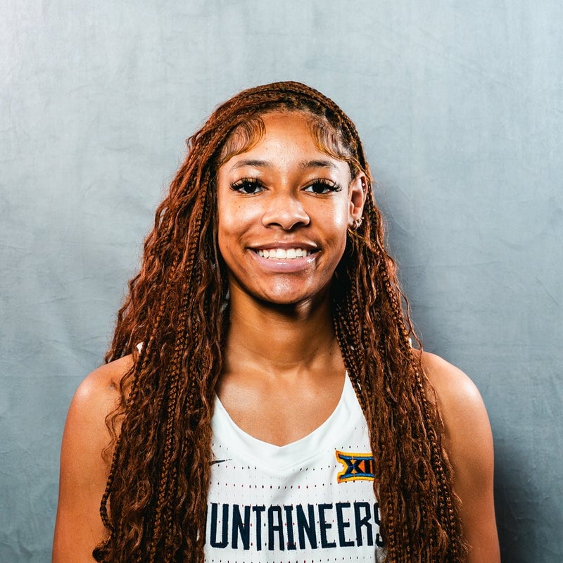 Mid-Back Copper Braids With Curled Ends — Trendy Basketball Hairstyles