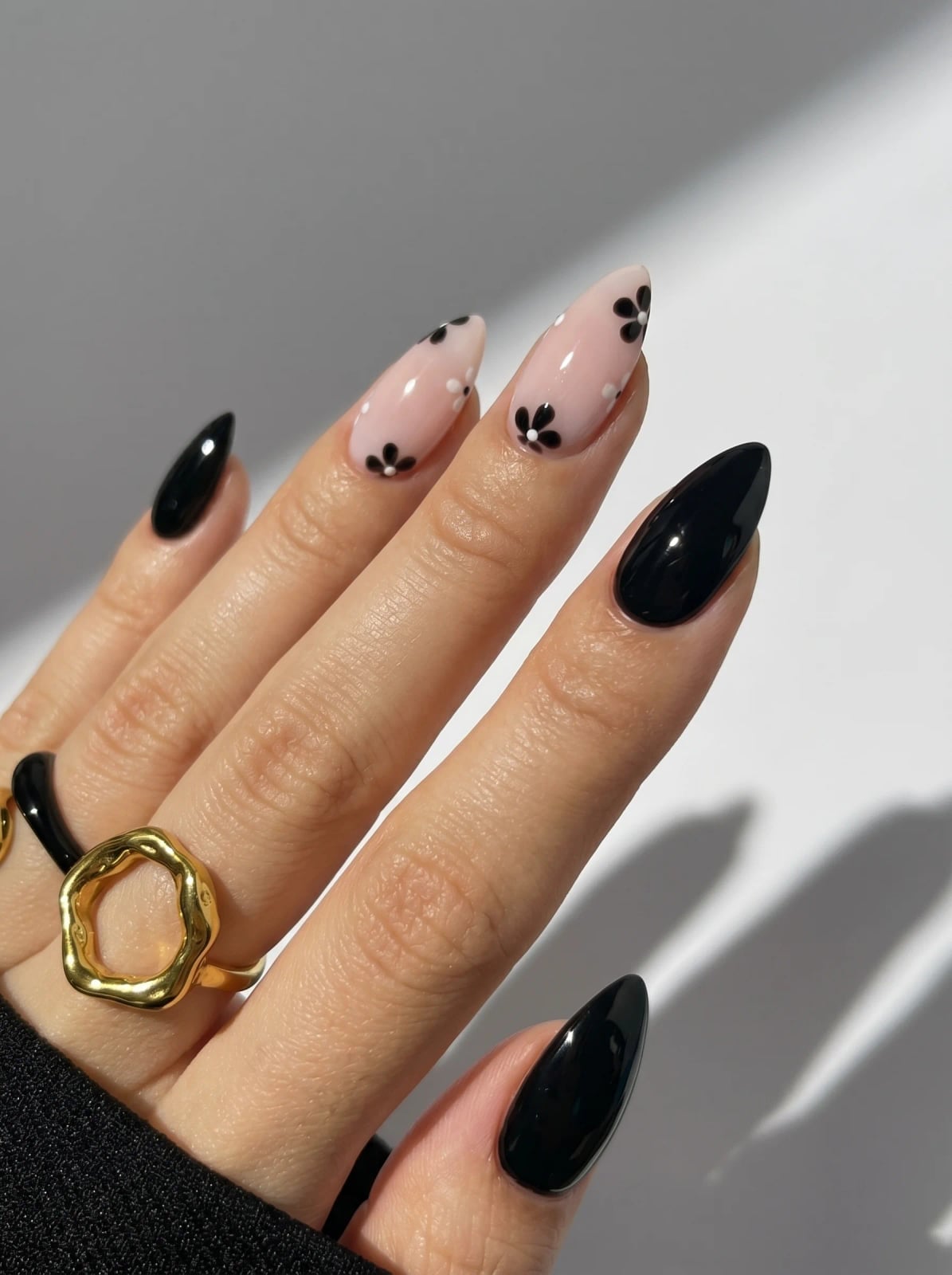 Medium Almond Glossy Black With Floral Accents Medium Almond Glossy Black With Floral Accents — Trendy Black Almond Nails