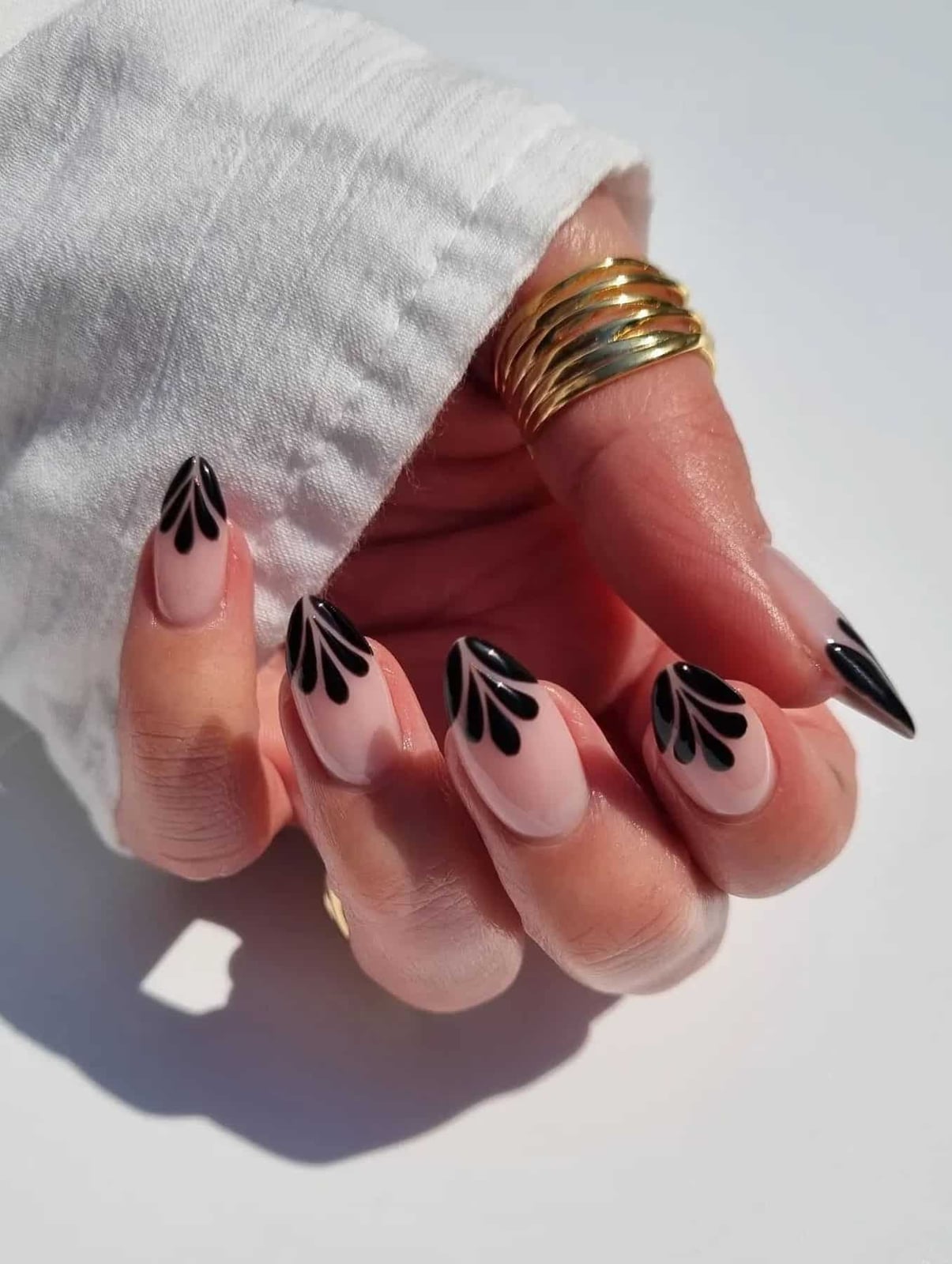 Medium Almond Sheer Nude With Graphic Black Art Medium Almond Sheer Nude With Graphic Black Art — Trendy Black Almond Nails