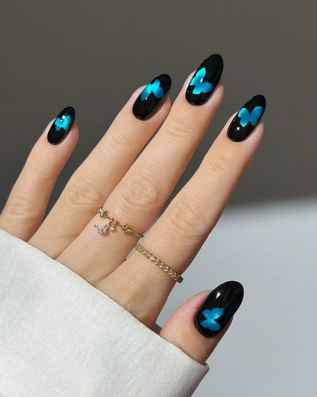 Medium Almond Glossy Black With Blue Butterflies Medium Almond Glossy Black With Blue Butterflies — Trendy Black Almond Nails