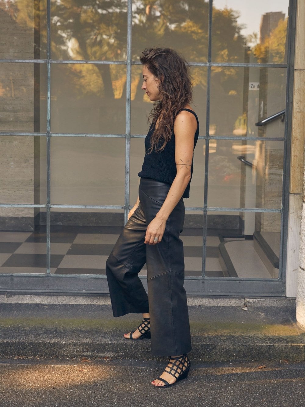 Black Leather Culottes with a Sleeveless Knit Top — Trendy Black Leather Pants Outfit