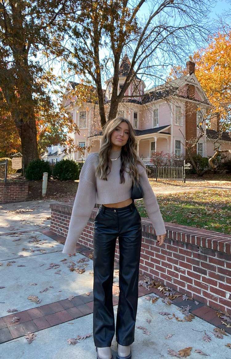 Wide-leg Black Leather Pants with a Beige Knit Sweater — Trendy Black Leather Pants Outfit