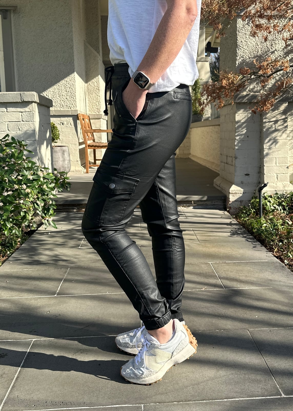 Black Leather Cargo Pants with a White T-Shirt — Trendy Black Leather Pants Outfit