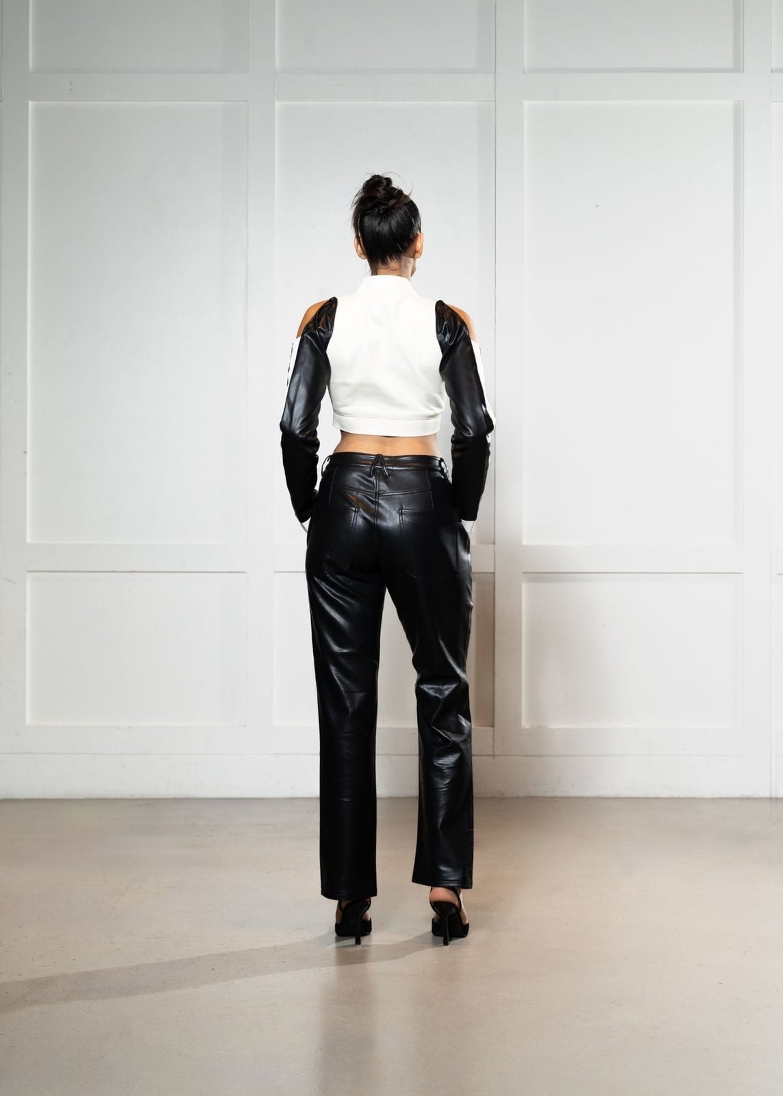 Black Vegan Leather Pants with a Cut-Out Top — Trendy Black Leather Pants Outfit