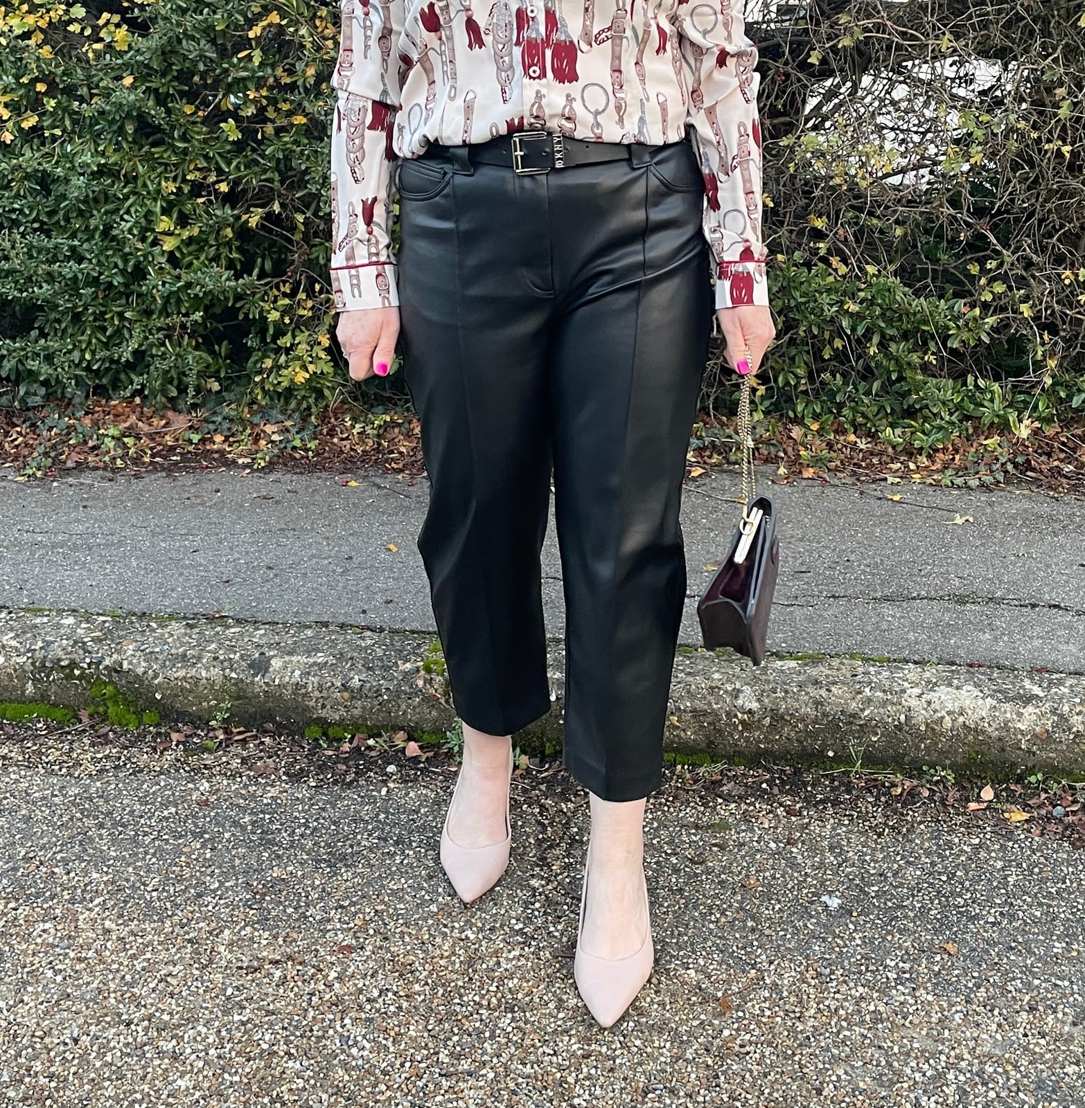 Black Faux Leather Straight-Leg Trousers with a Printed Shirt — Trendy Black Leather Pants Outfit