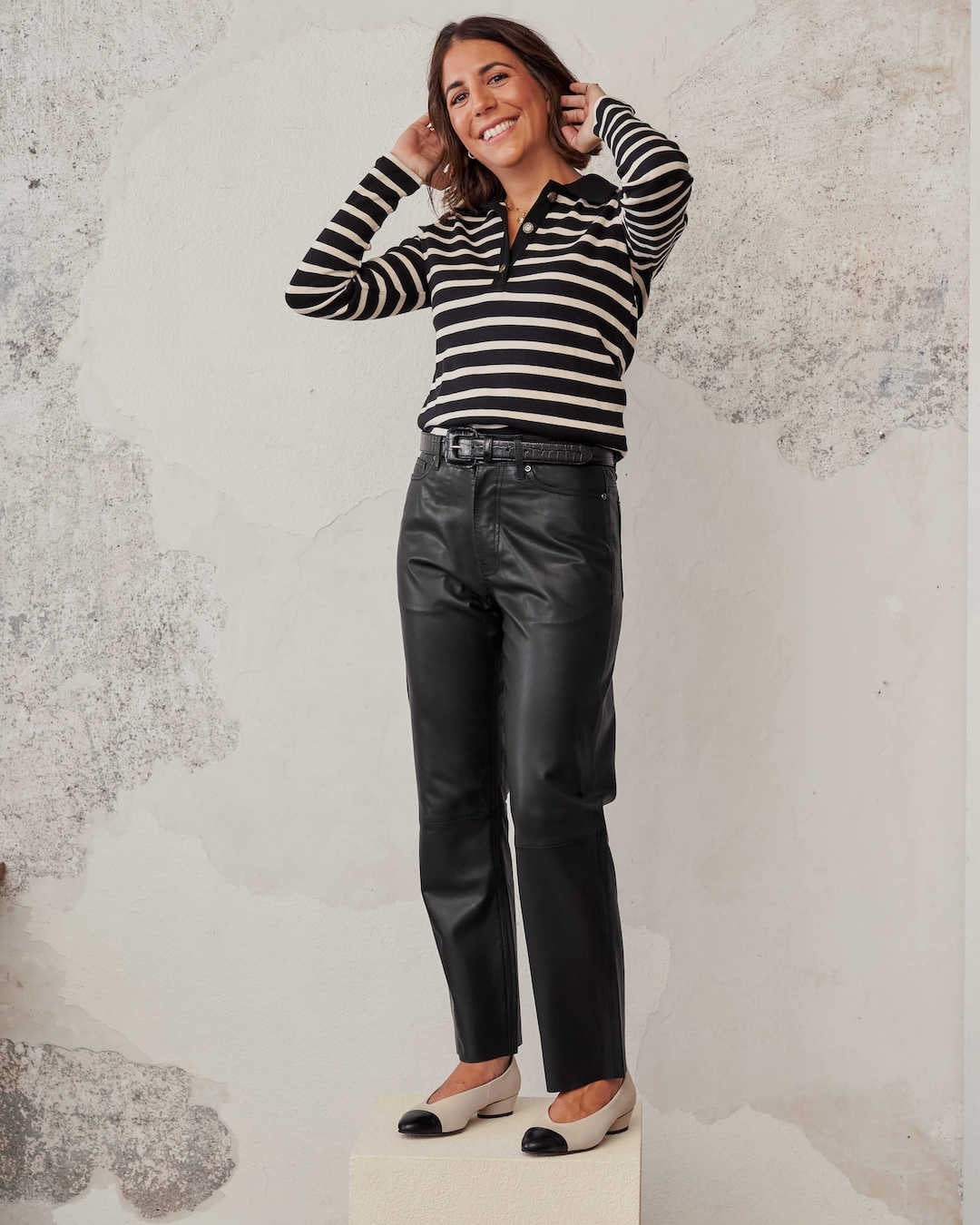 Black Leather Straight-Leg Pants with a Striped Polo Shirt — Trendy Black Leather Pants Outfit