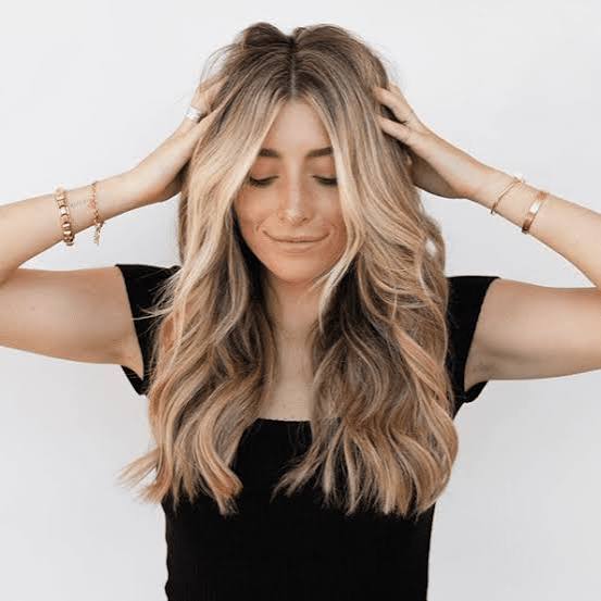 Golden Blonde Mid-Back Layers With Loose Waves — Trendy Blonde Hairstyles