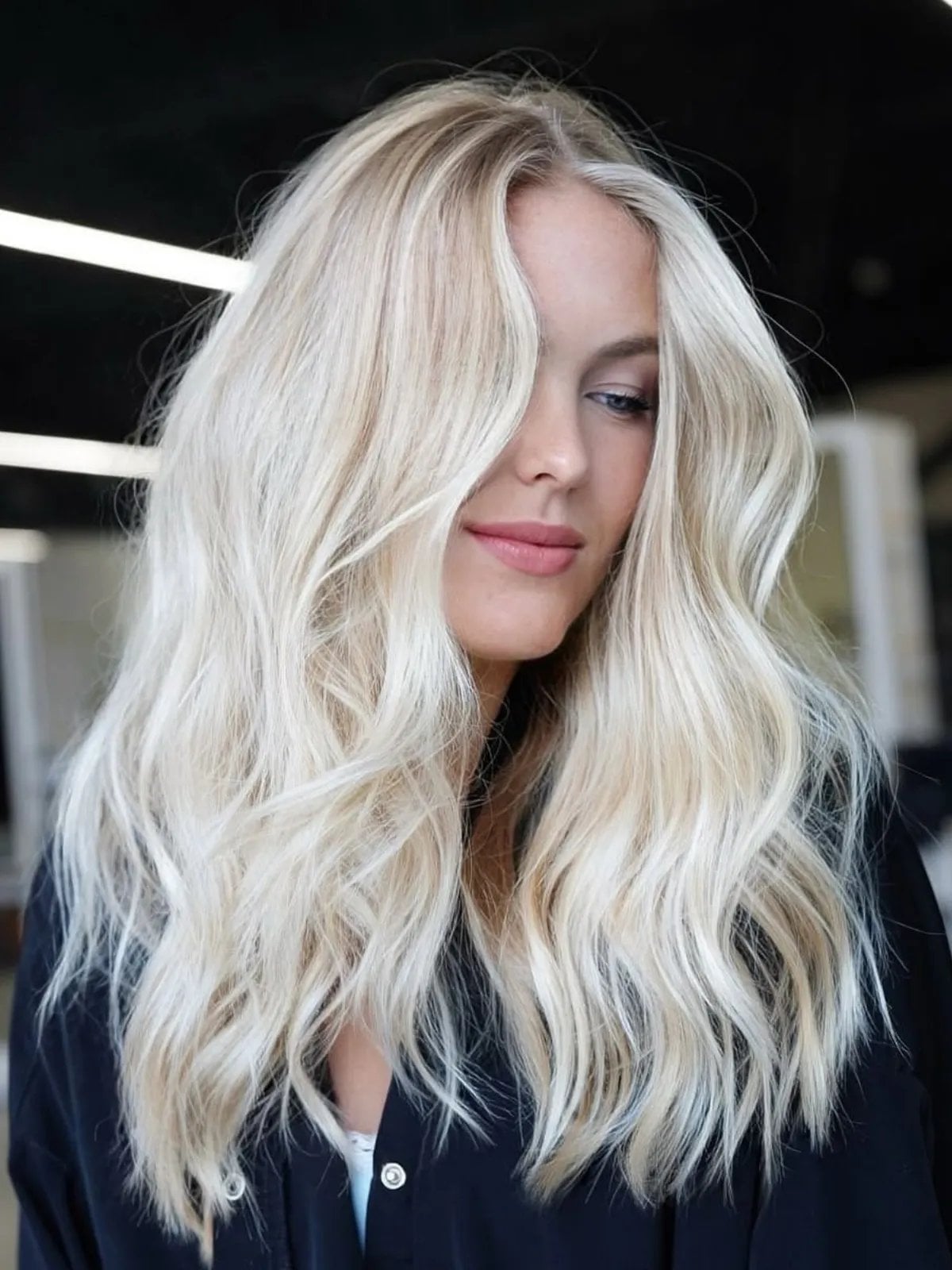 Platinum Blonde Mid-Back Layers With Wispy Bangs — Trendy Blonde Hairstyles