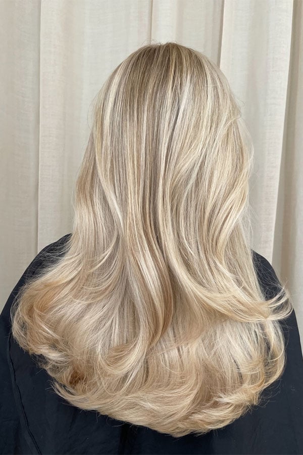 Sand Blonde Collarbone Lob With Layered Blowout — Trendy Blonde Hairstyles