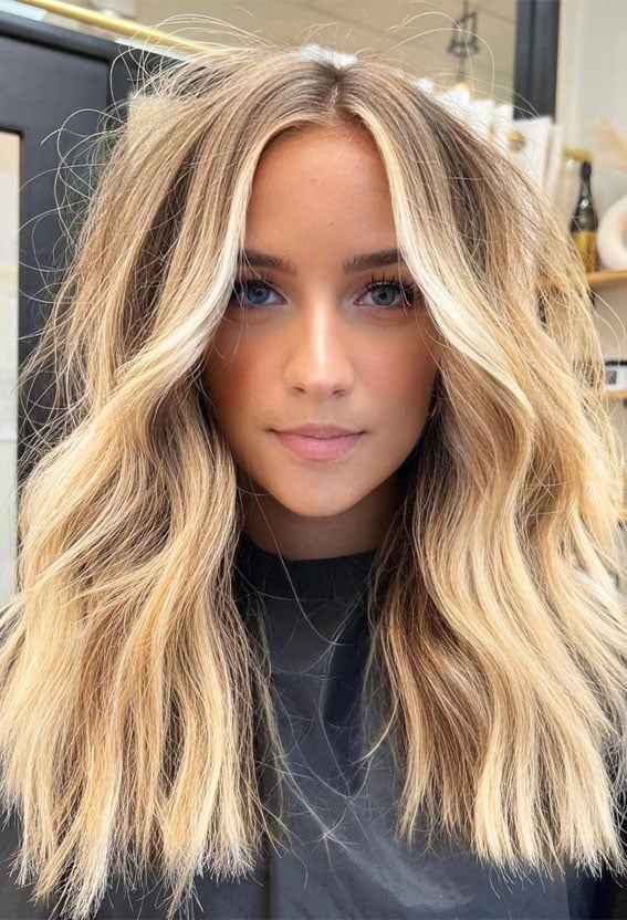 Dark Golden Blonde Mid-Back Layers With Face-Framing and Curtain Bangs — Trendy Blonde Hairstyles