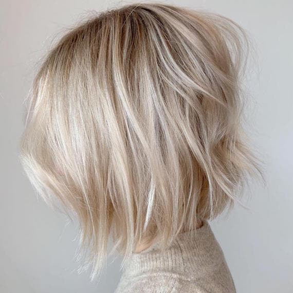 Platinum Blonde Collarbone Shag With Textured Layers — Trendy Blonde Hairstyles