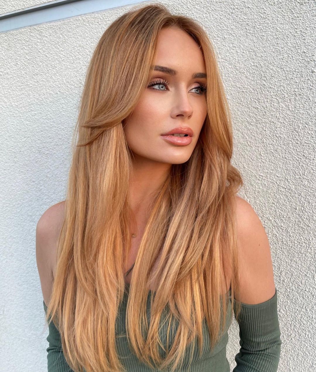 Strawberry Blonde Mid-Back Layers With Curtain Bangs — Trendy Blonde Hairstyles