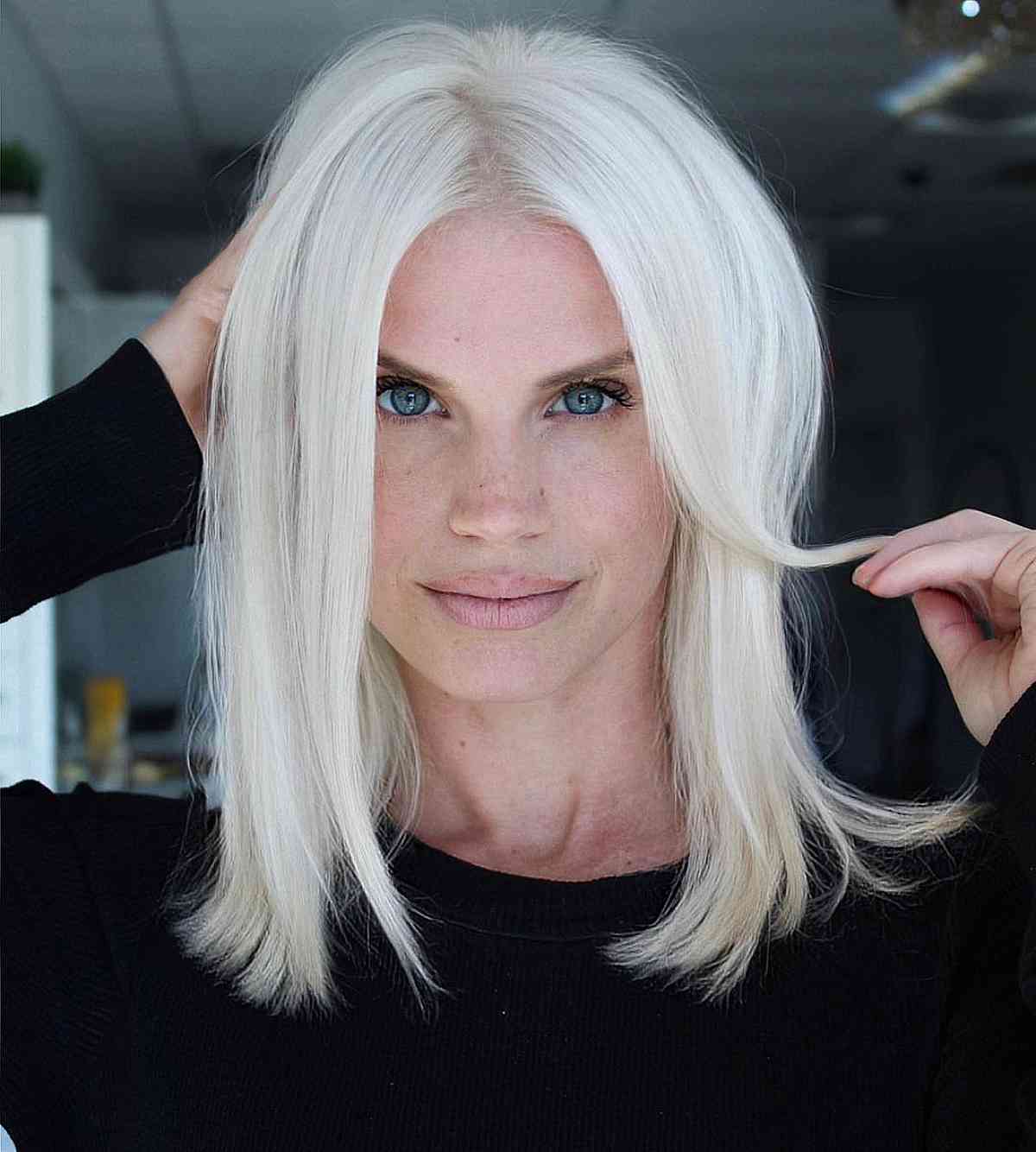 Pure White Blonde Collarbone Bob With Curtain Bangs — Trendy Blonde Hairstyles