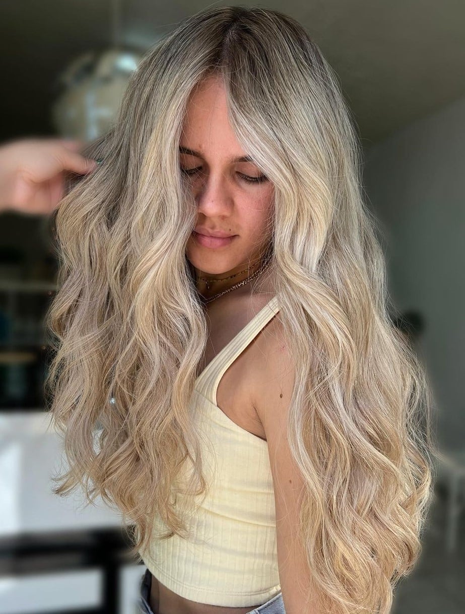 Mid-Back Blonde Balayage With Warm Tones Mid-Back Blonde Balayage With Warm Tones — Trendy Blonde Wavy Hair
