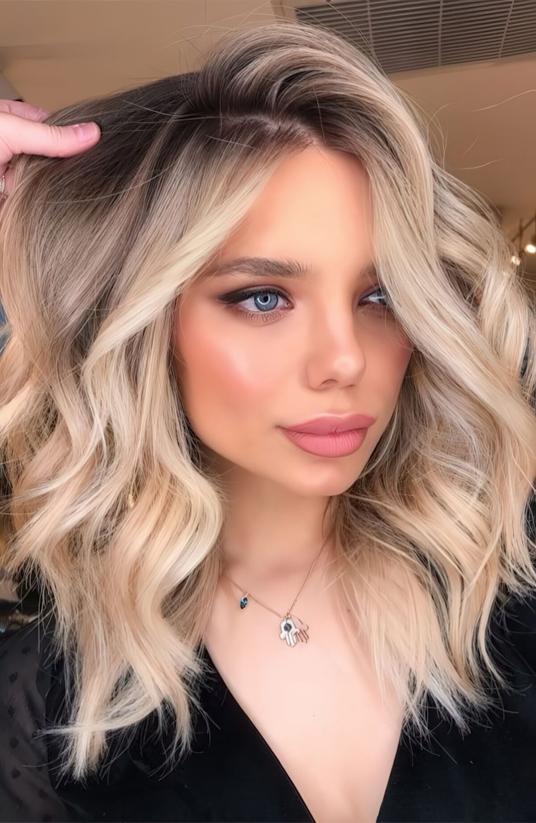 Collarbone Rooty Blonde Balayage With Side-Swept Bangs Collarbone Rooty Blonde Balayage With Side-Swept Bangs — Trendy Blonde Wavy Hair