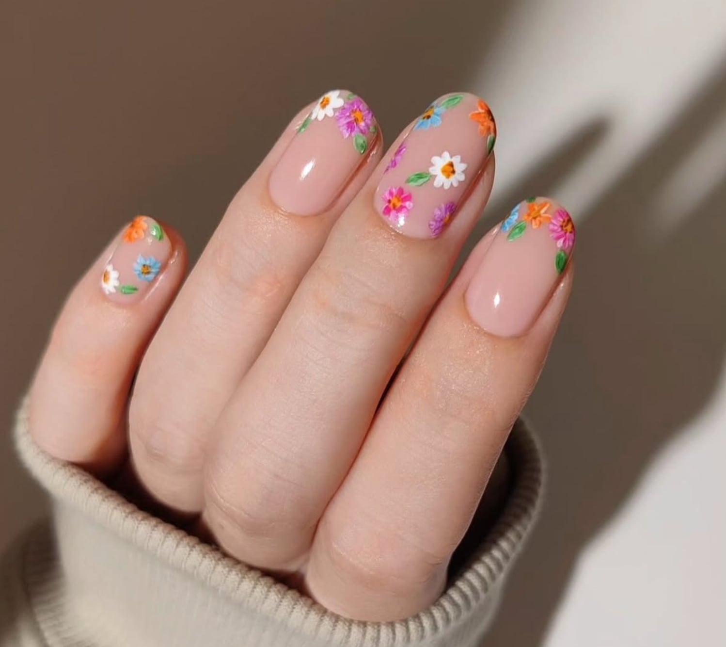 Short Oval Nude With Cuticle Floral Accents Short Oval Nude With Cuticle Floral Accents — Trendy Boho Nails