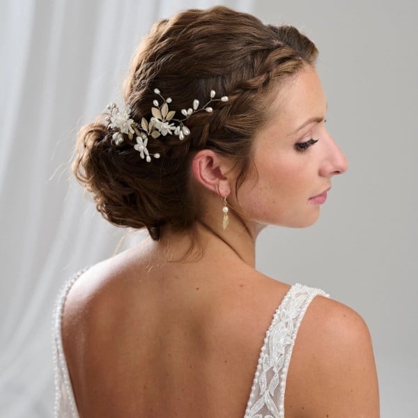 Braided Updo With Floral Accessory — Trendy Bridal Hairstyles