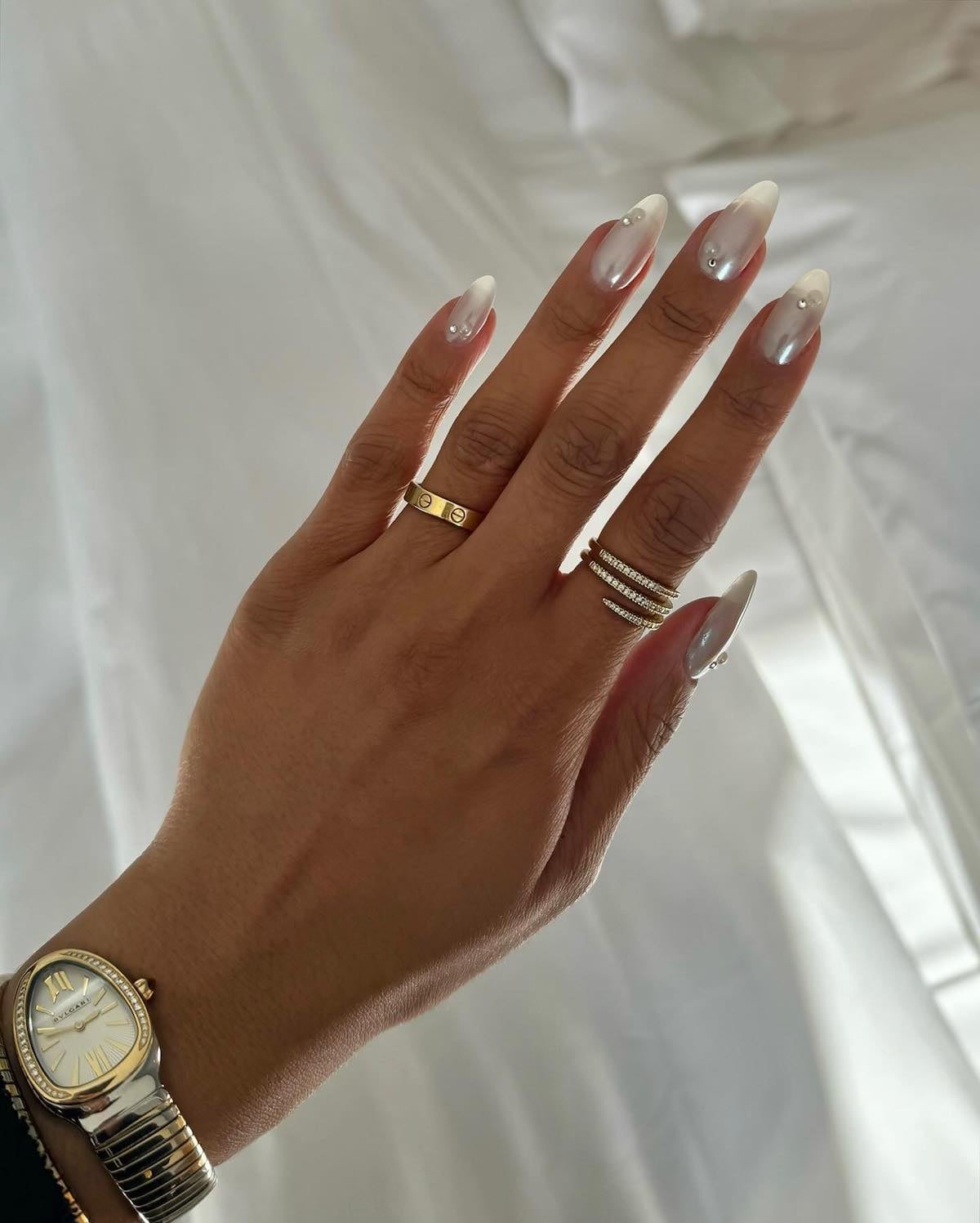 Milky White Iridescent Almond Nails With Pearls And Rhinestones Milky White Iridescent Almond Nails With Pearls And Rhinestones — Trendy Bride Nail