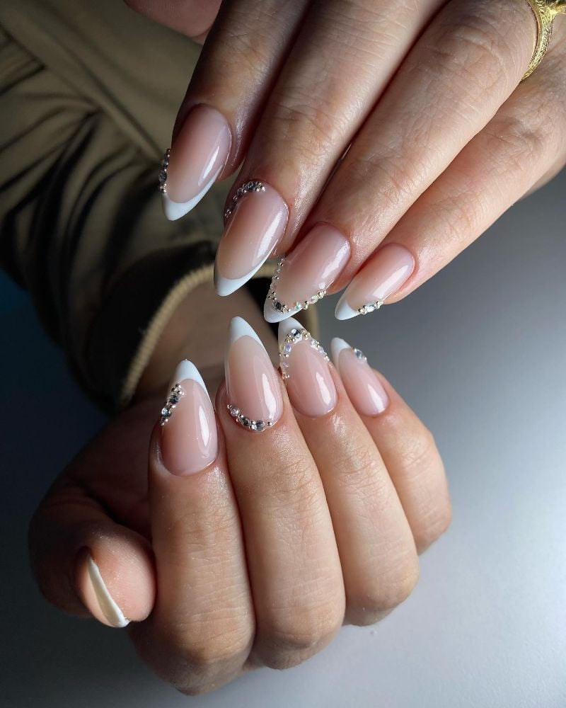 Medium Almond French Tips With Rhinestone Accents Medium Almond French Tips With Rhinestone Accents — Trendy Bride Nail
