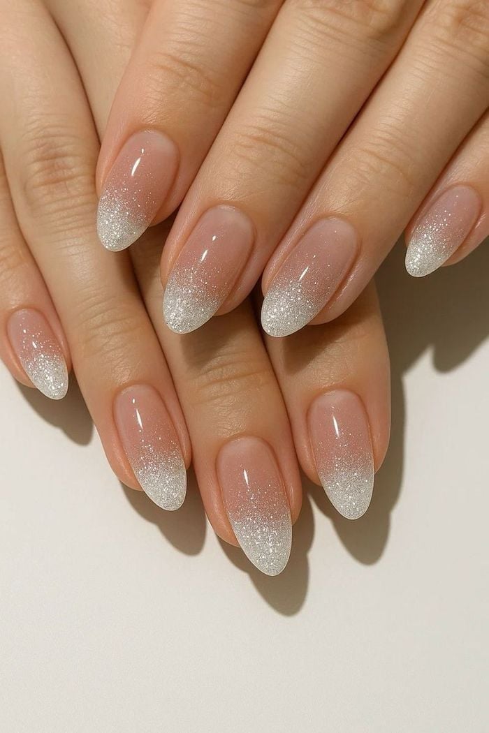 Sheer Nude Medium Almond Nails With Silver Glitter Fade Sheer Nude Medium Almond Nails With Silver Glitter Fade — Trendy Bride Nail