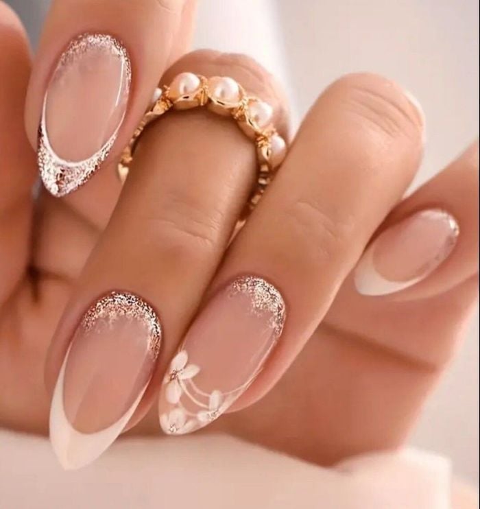 Oval French Tips With Gold Glitter And Floral Art Oval French Tips With Gold Glitter And Floral Art — Trendy Bride Nail