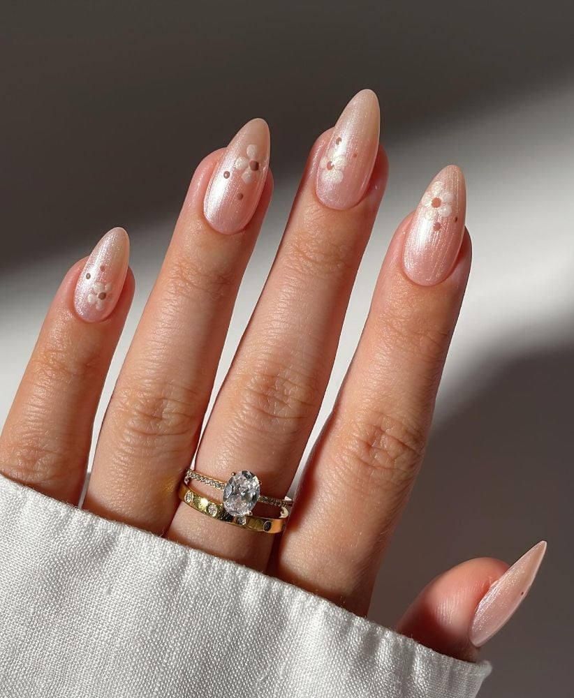 Pale Peach Shimmer Almond Nails With Floral Motifs Pale Peach Shimmer Almond Nails With Floral Motifs — Trendy Bride Nail
