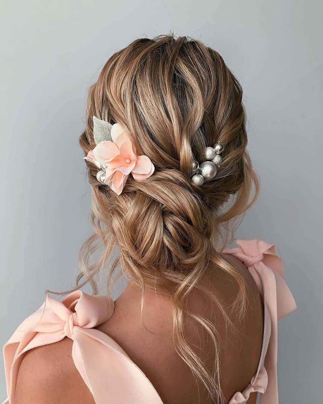 Honey Blonde Textured Low Bun With Flower Honey Blonde Textured Low Bun With Flower — Trendy Bridesmaid Hair Updo
