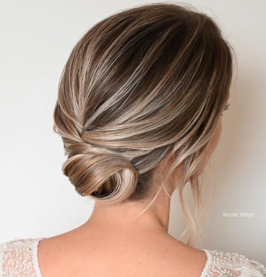 Blonde Twisted Low Bun With Root Shadow Blonde Twisted Low Bun With Root Shadow — Trendy Bridesmaid Hair Updo