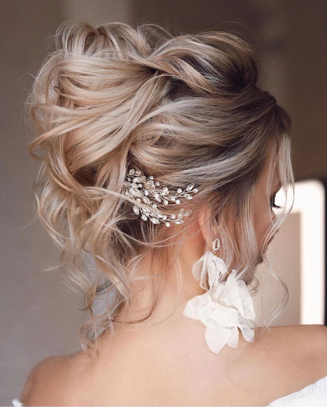 Platinum Blonde Voluminous Wavy Updo Platinum Blonde Voluminous Wavy Updo — Trendy Bridesmaid Hair Updo