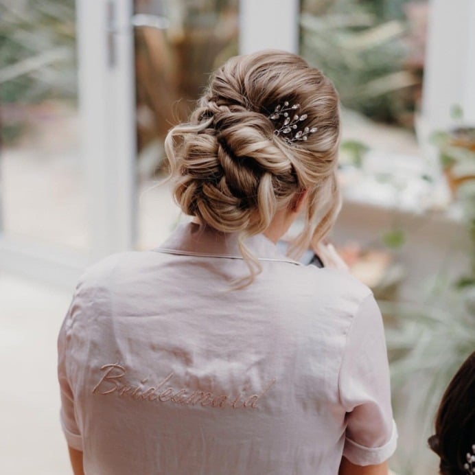 Ash Blonde Braided Updo With Accessory Ash Blonde Braided Updo With Accessory — Trendy Bridesmaid Hair Updo