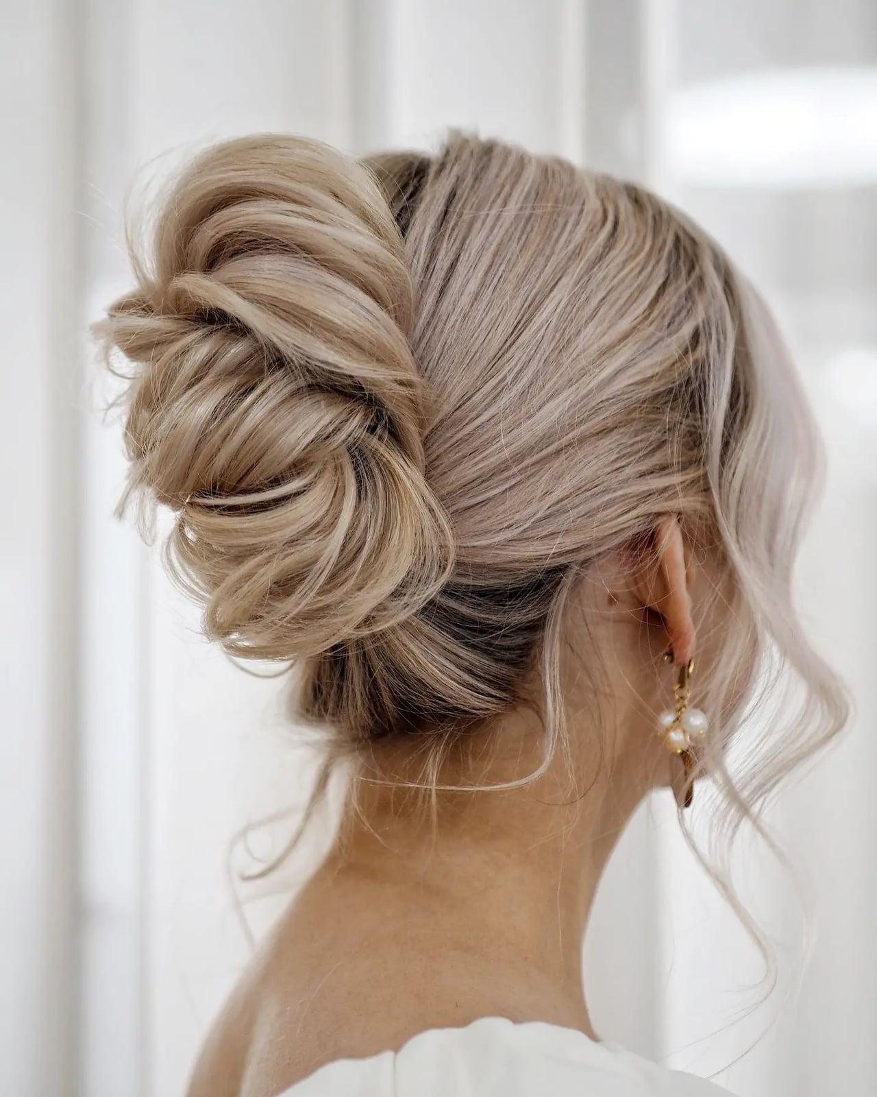 Ash Blonde Textured Bun With Tendrils Ash Blonde Textured Bun With Tendrils — Trendy Bridesmaid Hair Updo