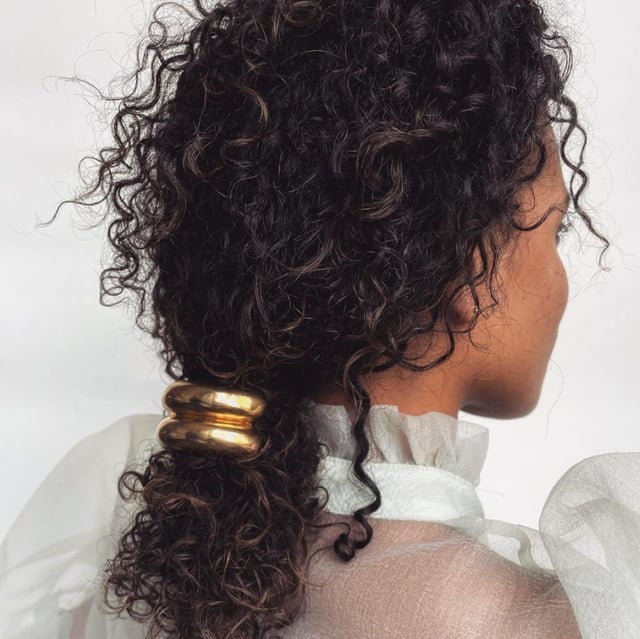 Shoulder Length Curly Ponytail — Trendy Brown Curly Hair