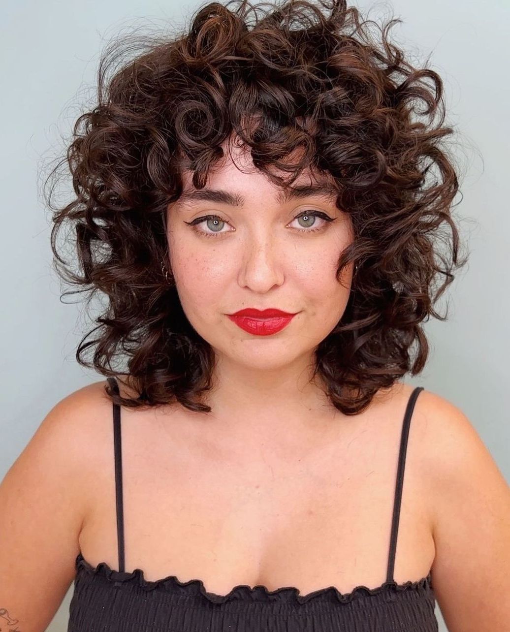 Shoulder Length Layers With Full Bangs — Trendy Brown Curly Hair