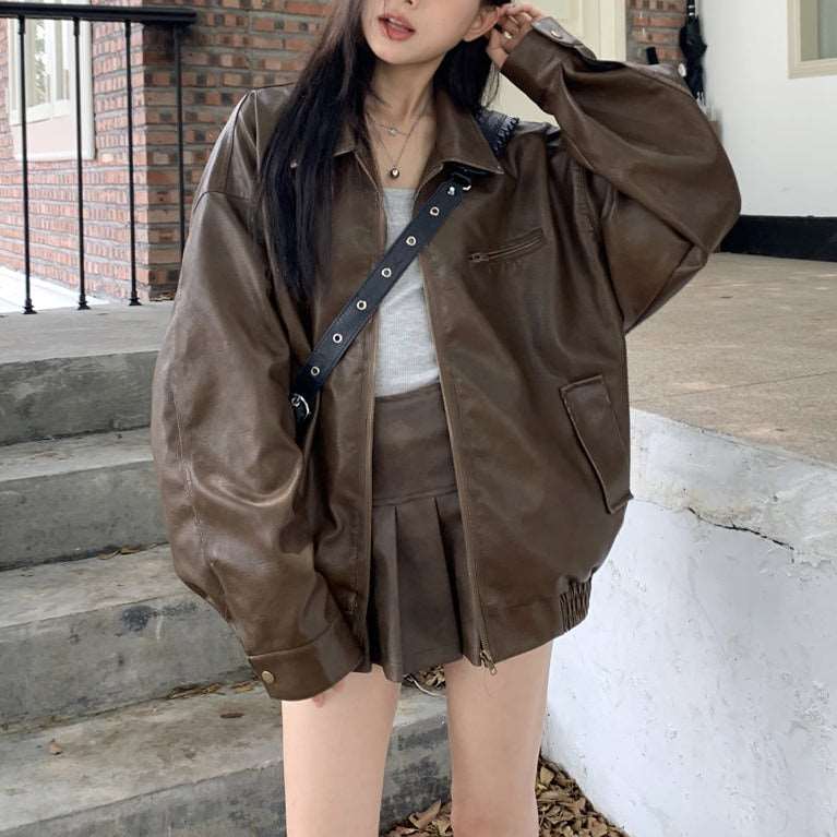 Pleated Mini Skirt with Oversized Leather Jacket and Crossbody Bag Pleated Mini Skirt with Oversized Leather Jacket and Crossbody Bag — Trendy Brown Leather Skirt Outfit