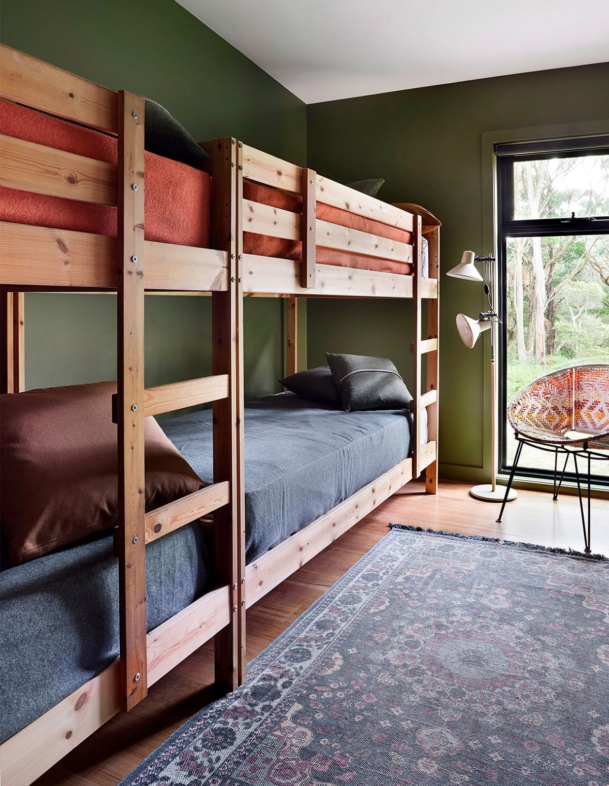 Sturdy Wooden Bunk Bed with Green Walls and Patterned, Close-Up Take Sturdy Wooden Bunk Bed with Green Walls and Patterned, Close-Up Take — Trendy Bunk Bed Ideas