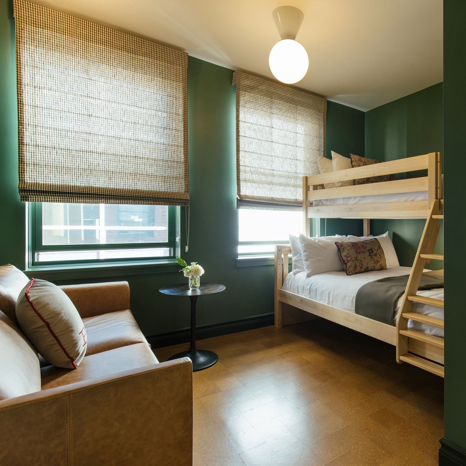 Hotel Room with Rustic Wooden Bunk Bed and Green Walls Hotel Room with Rustic Wooden Bunk Bed and Green Walls — Trendy Bunk Bed Ideas