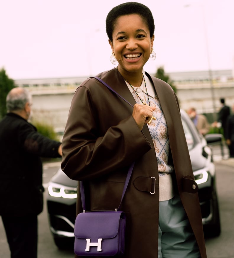 Leather Coat Over a Patterned Knit and Light Blue Trousers — Trendy Business Casual Outfits Black Women