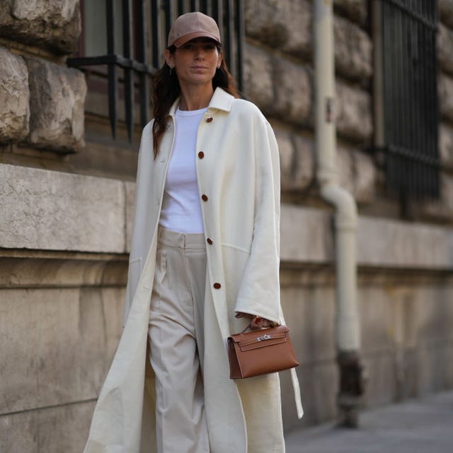 Long Cream Coat Over a T-Shirt and Beige Trousers Long Cream Coat Over a T-Shirt and Beige Trousers — Trendy Casual Church Outfit