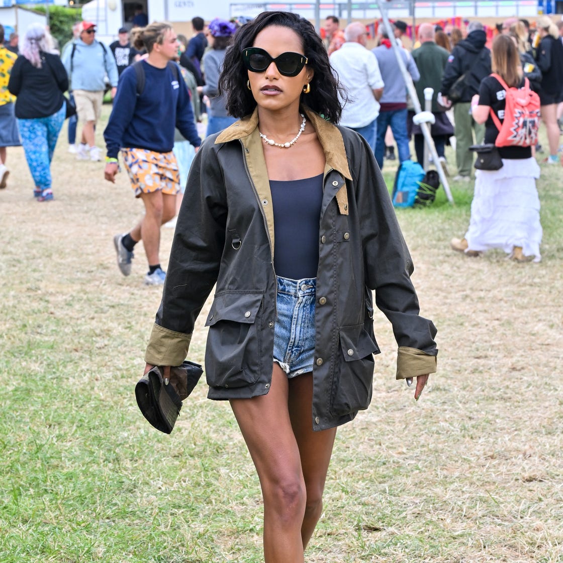 Navy Bodysuit Under Dark Green Waxed Jacket with Denim Shorts Navy Bodysuit Under Dark Green Waxed Jacket with Denim Shorts — Trendy Casual Concert Outfit
