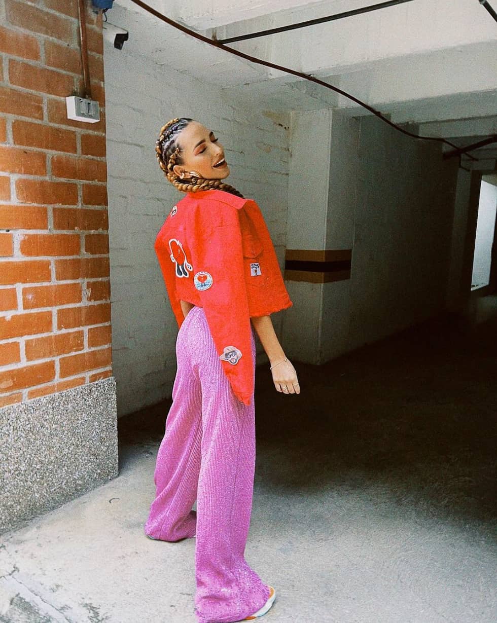 Red Cropped Jacket Over Pink Metallic Knit Top with Wide-Leg Pants Red Cropped Jacket Over Pink Metallic Knit Top with Wide-Leg Pants — Trendy Casual Concert Outfit