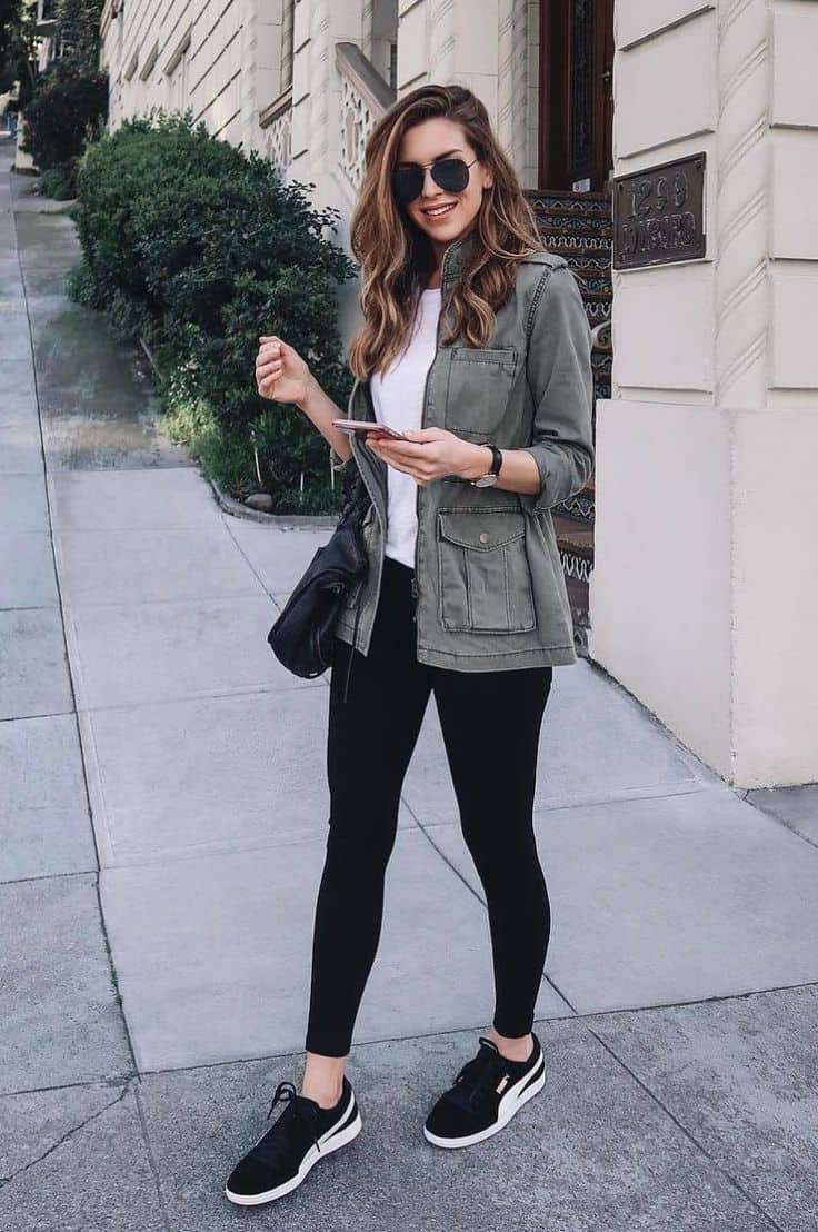 Olive Green Utility Jacket Over White T-Shirt and Black Skinny Pants Olive Green Utility Jacket Over White T-Shirt and Black Skinny Pants — Trendy Casual Concert Outfit