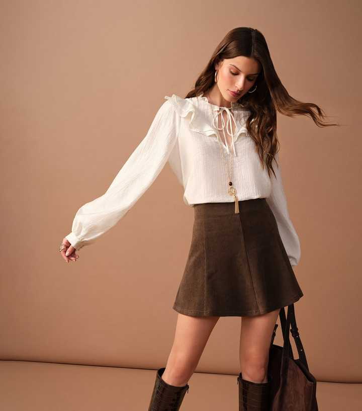 Brown Corduroy Mini Skirt with Ruffled Blouse, Close-Up Take — Trendy Corduroy Skirt Outfit