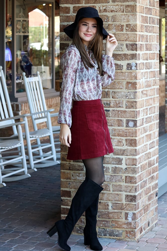 Burgundy Corduroy Mini Skirt with Front Zip and Wide-Brim Hat — Trendy Corduroy Skirt Outfit