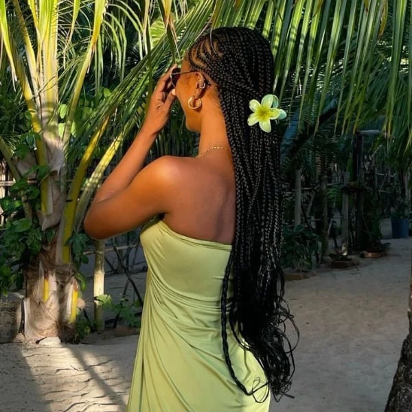 Mid-Back Box Braids With Flower Accessory Mid-Back Box Braids With Flower Accessory — Trendy Cornrows Braids for Black Women