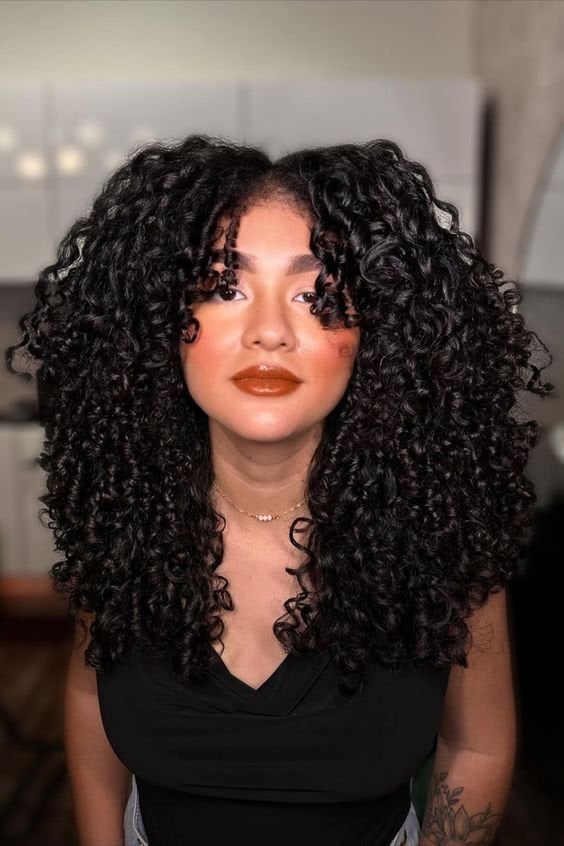 Mid-Back Layers With Face-Framing Bangs — Trendy Curly Hair Products