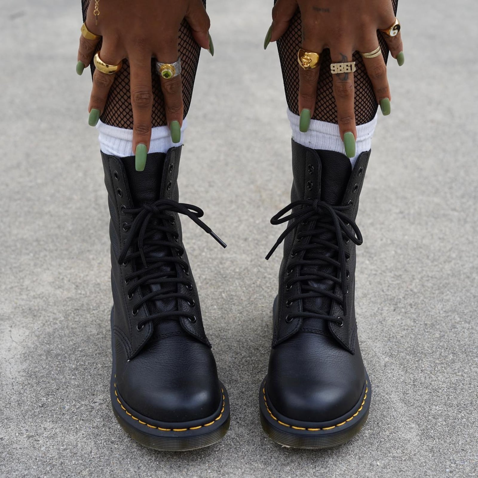 Black Lace-Up Boots With Fishnet Tights And Rings — Trendy Doc Martens Outfits