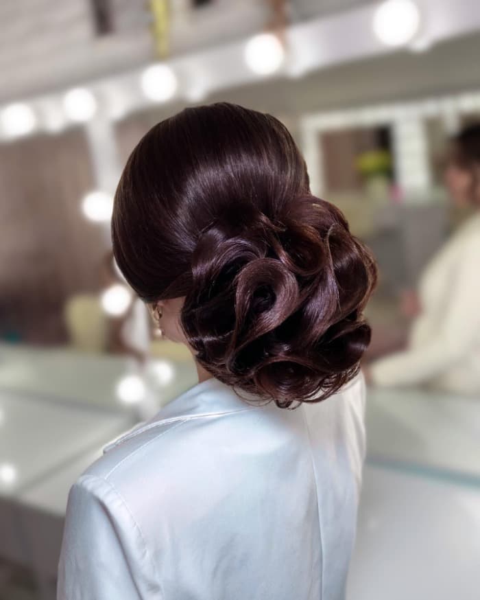 Voluminous Sculpted Dark Brown Bun, Long Voluminous Sculpted Dark Brown Bun, Long — Trendy Formal Updos