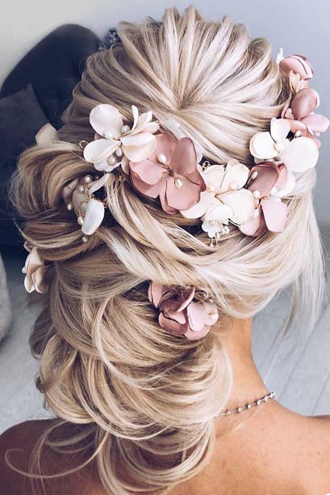 Voluminous Twisted Blonde Bun With Accessory Voluminous Twisted Blonde Bun With Accessory — Trendy Formal Updos