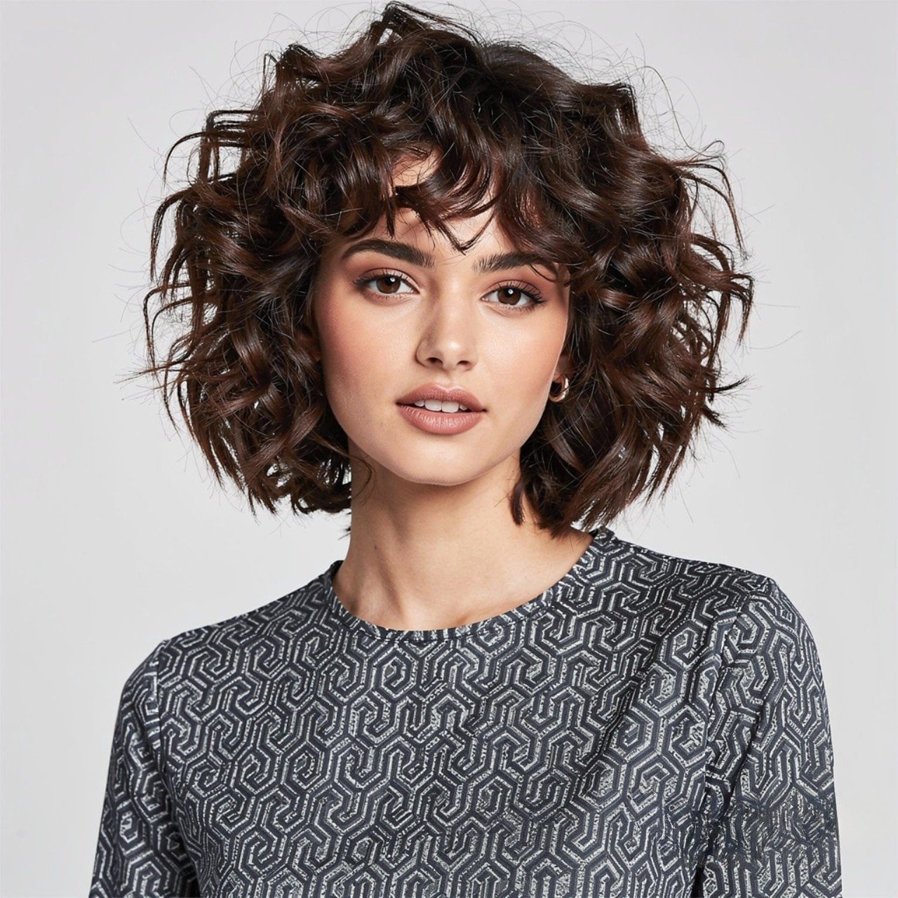 Chin Bob With Defined Curls And Short Bangs — Trendy Frizzy Hair