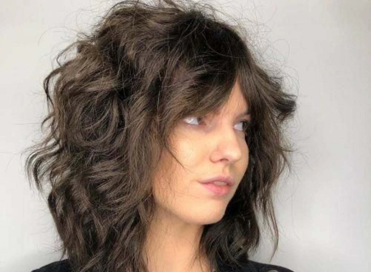 Collarbone Shag With Curtain Bangs — Trendy Frizzy Hair